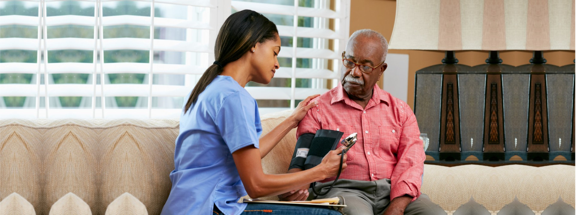 caregiver giving the patient a medicine