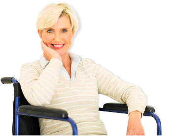 smiling patient sitting in a wheelchair